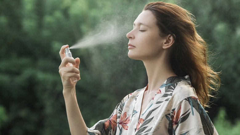 woman spraying mist