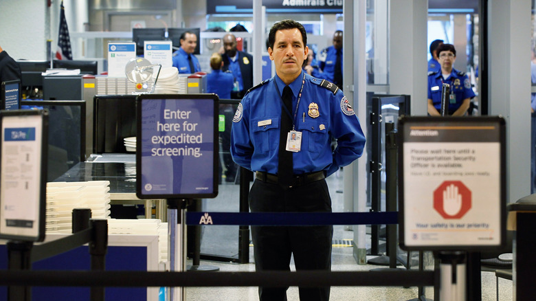 officers in airport expedited screening