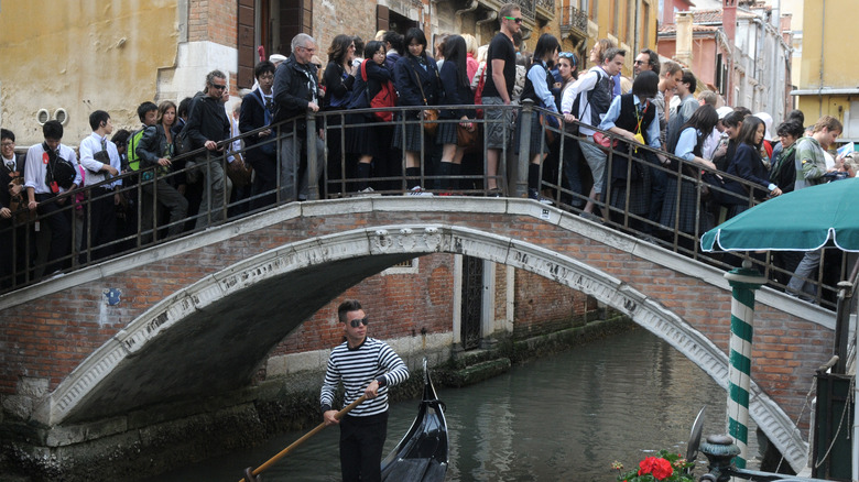 Venice crowd crossing bridge
