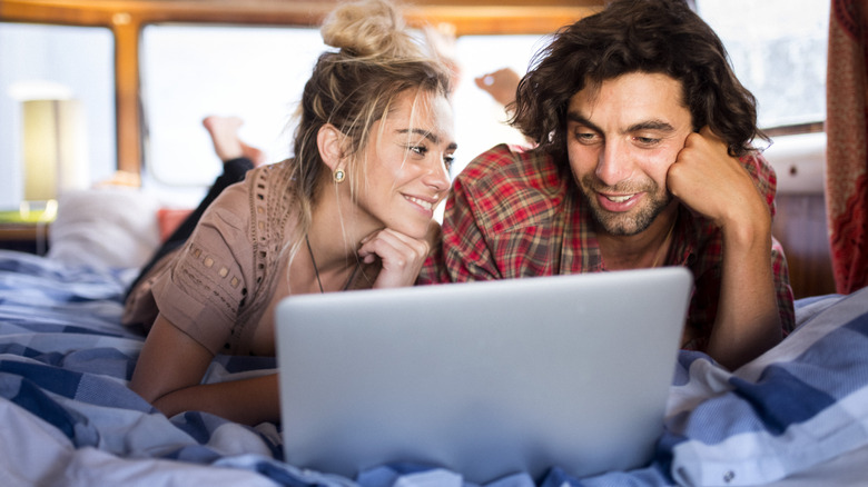 couple in RV on computer