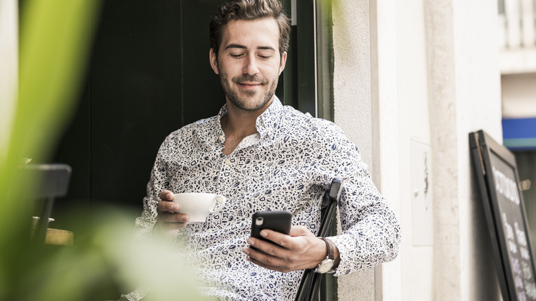 Traveler holding a coffee cup