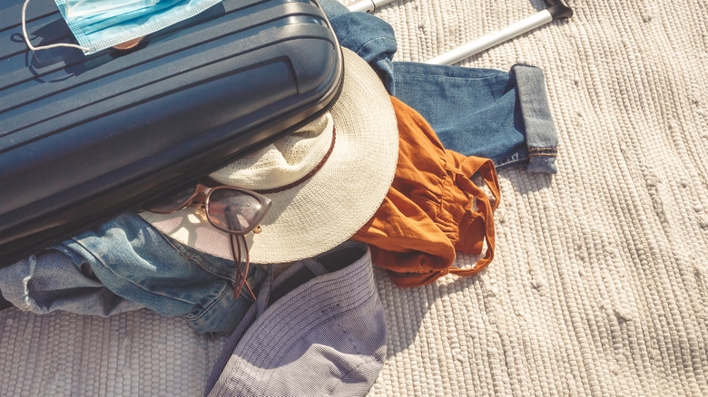 hat in a suitcase