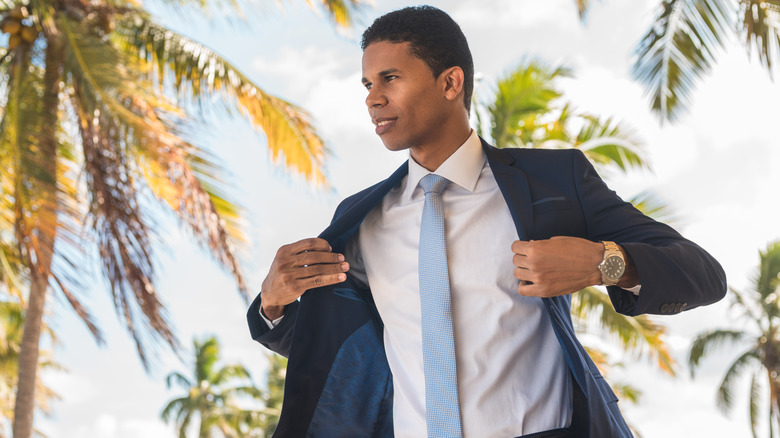 Man in suit on beach