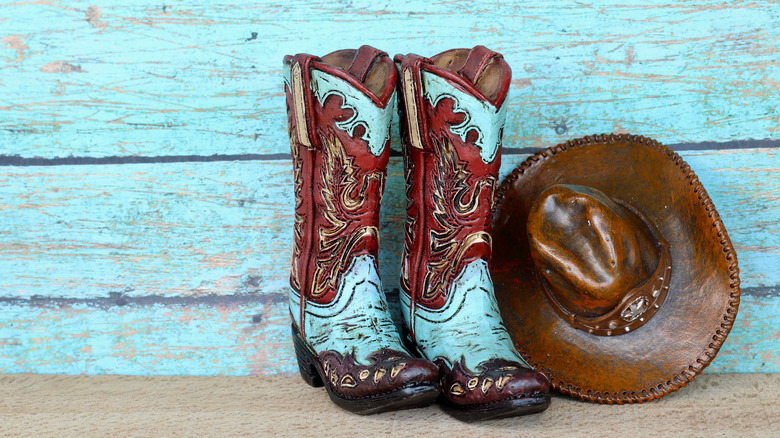 staged cowboy boots and hat