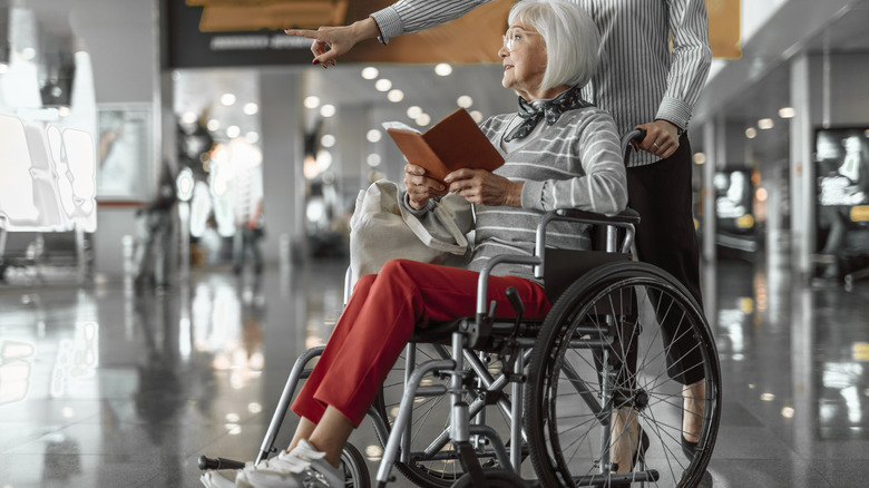 Wheelchair attendant and woman