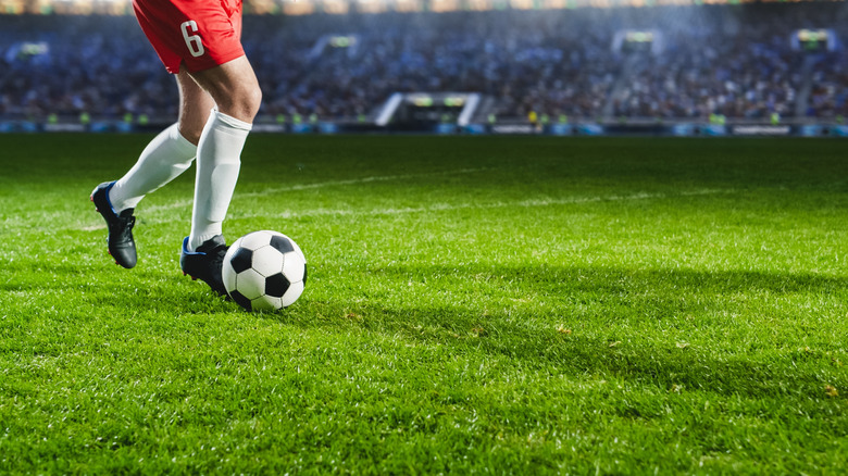 Footballer kicking a ball