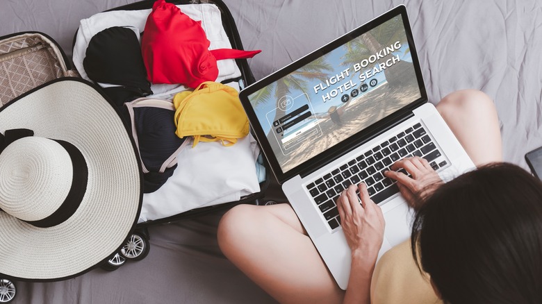 woman travel planning on laptop