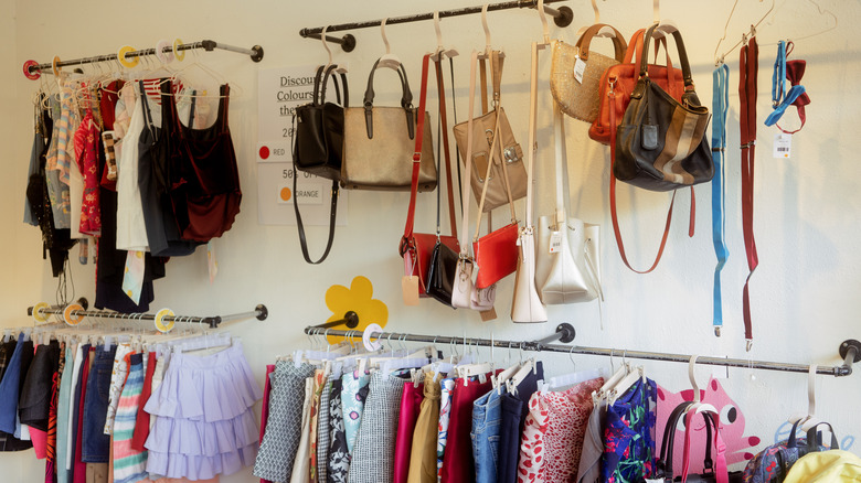 bags and clothes on store rack