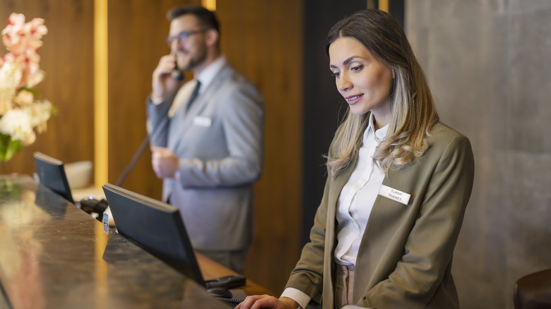 Employee at a hotel front desk