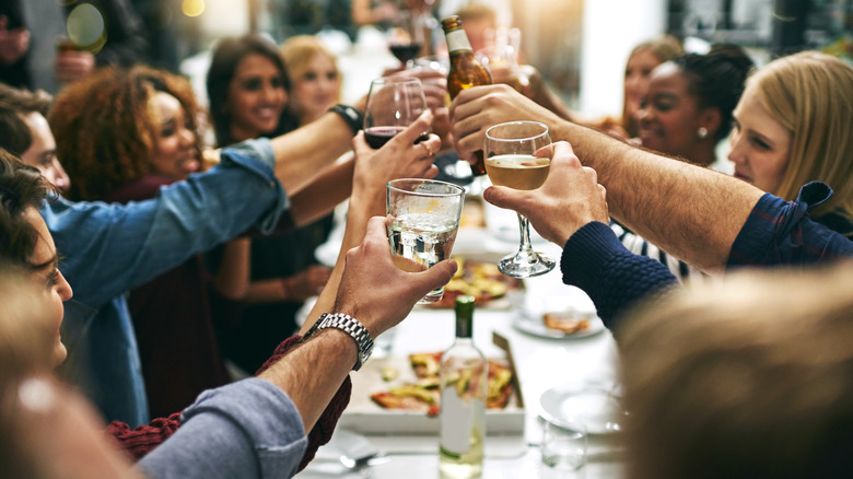 Friends gathered around a table, dining.