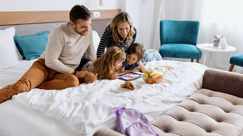 Family enjoying hotel room