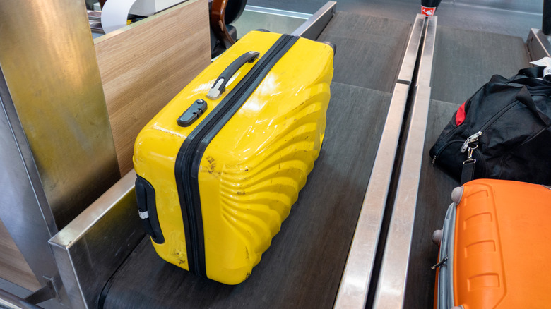suitcases at airport check-in counter