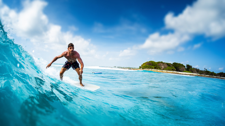 Surfer at Sultans, Maldives