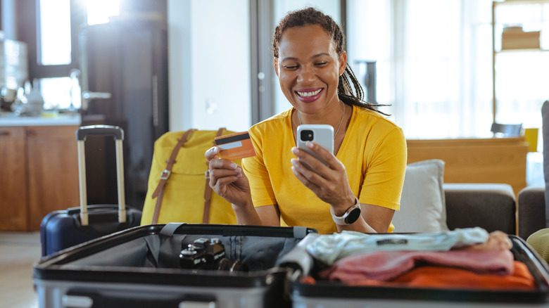 traveling woman making online booking