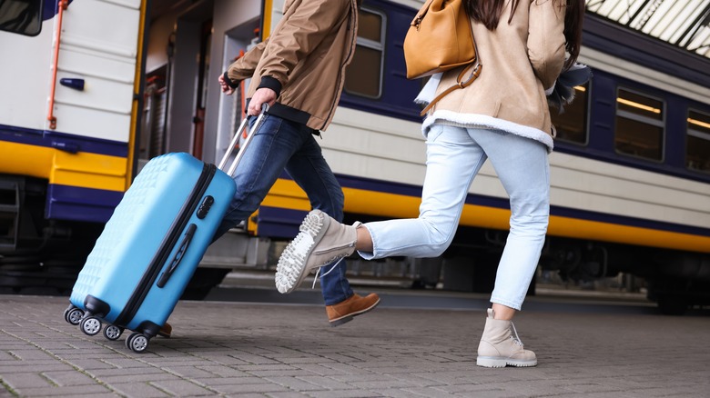 Travelers running late to their train