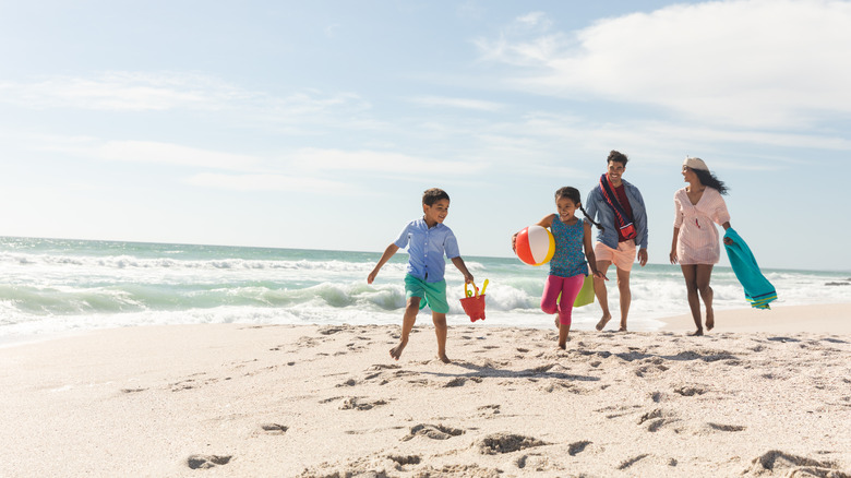 family enjoying beach