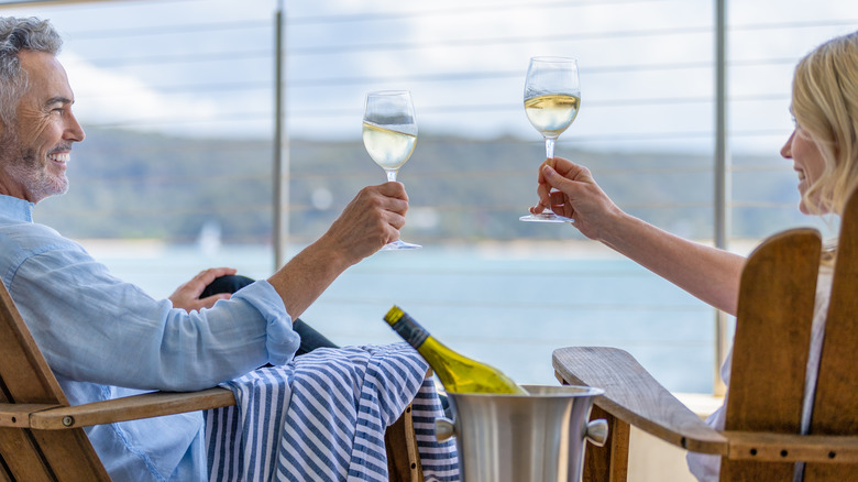 couple drinking wine on deck