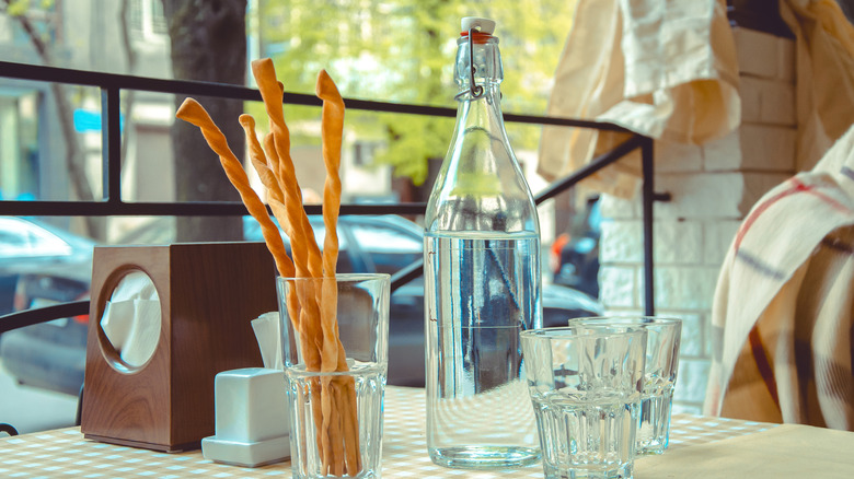 Bottle of water on a table at an Italian restaurant