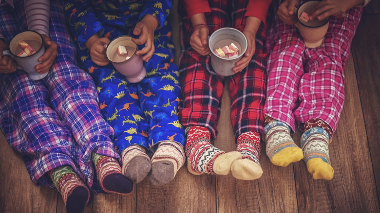 Kids in pjs with hot cocoa