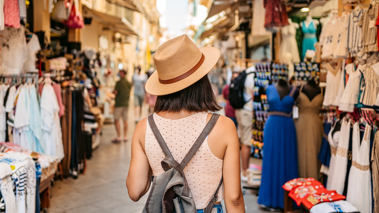 solo traveler walking in market