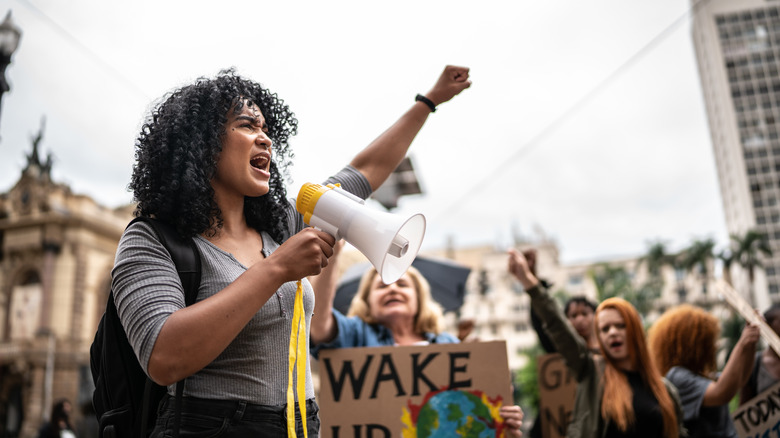 Woman protesting in a crowd