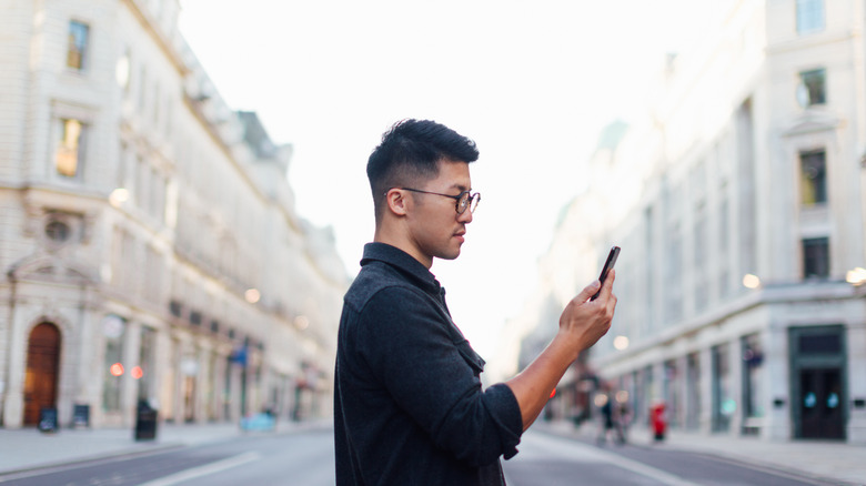 man looking at phone