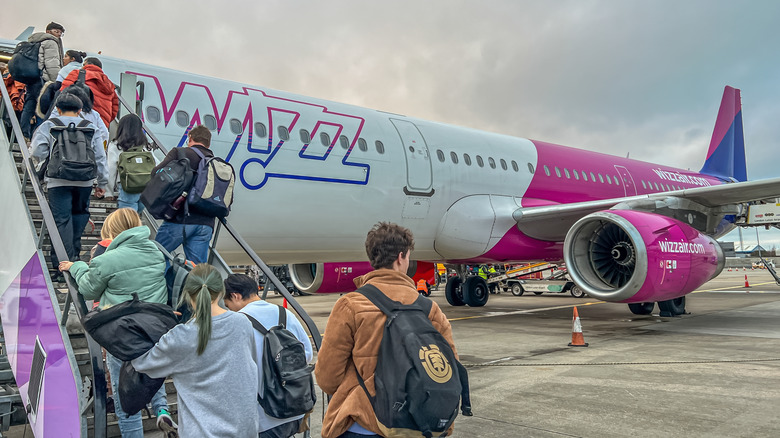 passengers board wizz air flight