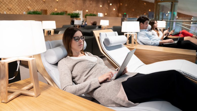 woman relaxing in airport lounge