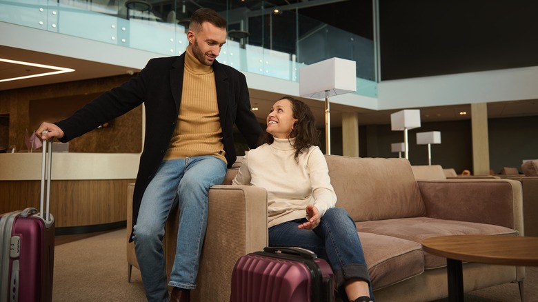 couple sitting in airport lounge