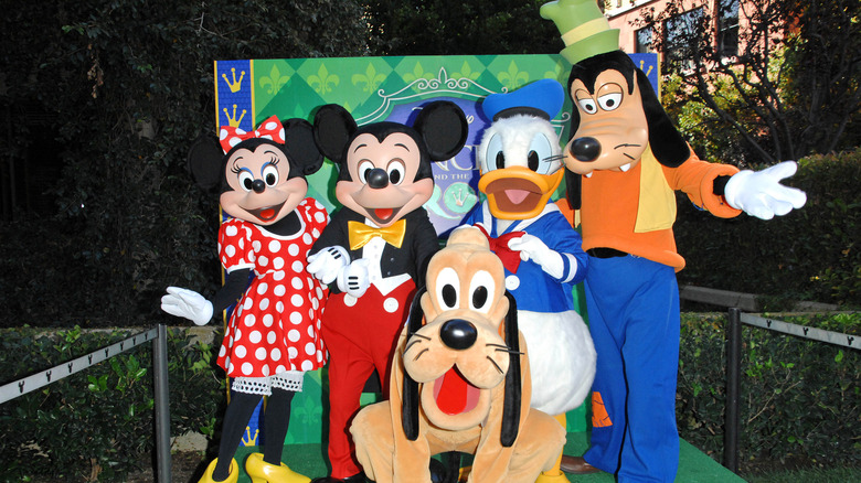 Disney characters posing for photo