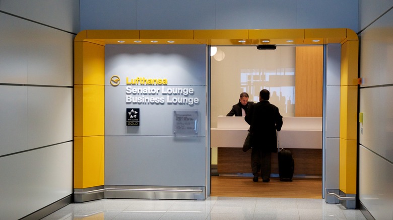 Businessperson checking into Luftansa lounge