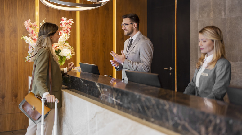 woman checking into hotel