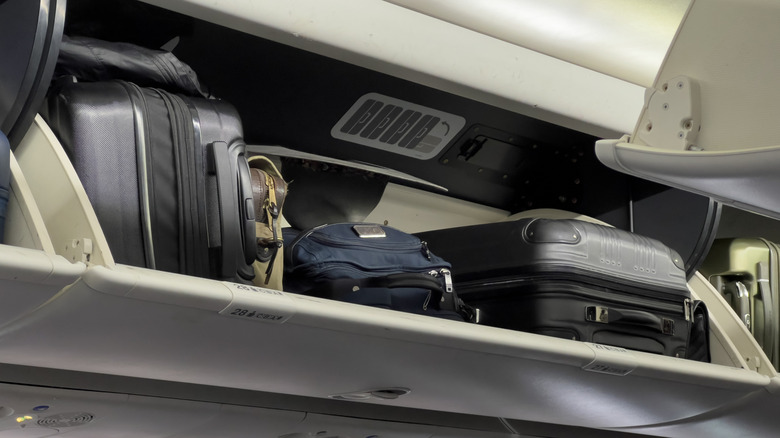 Carry-on luggage in overhead bin