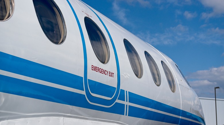 exterior of plane showing emergency exit door