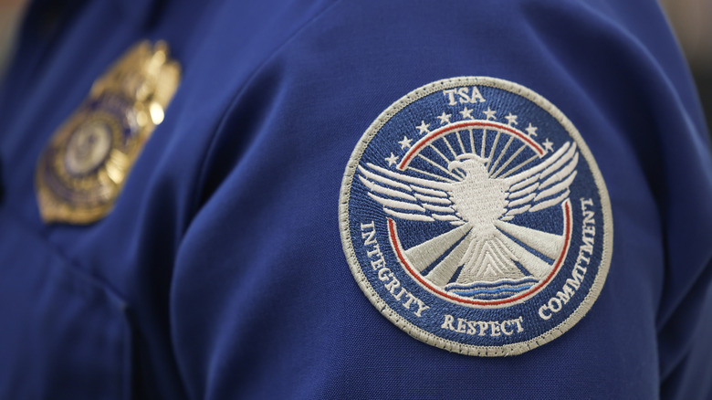 A TSA agent badge on a uniform