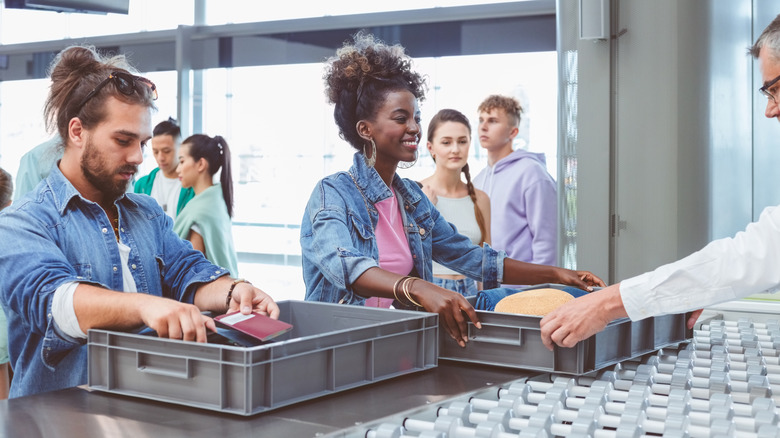 Travelers going through airport security.