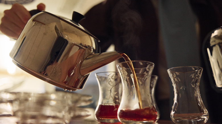 A Turkish local pouring black tea