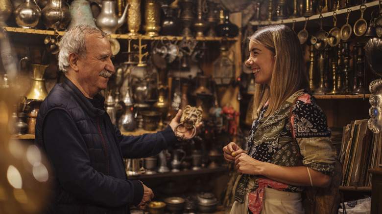 A traveler and shop owner exchanging a smile in a local Istanbul shop