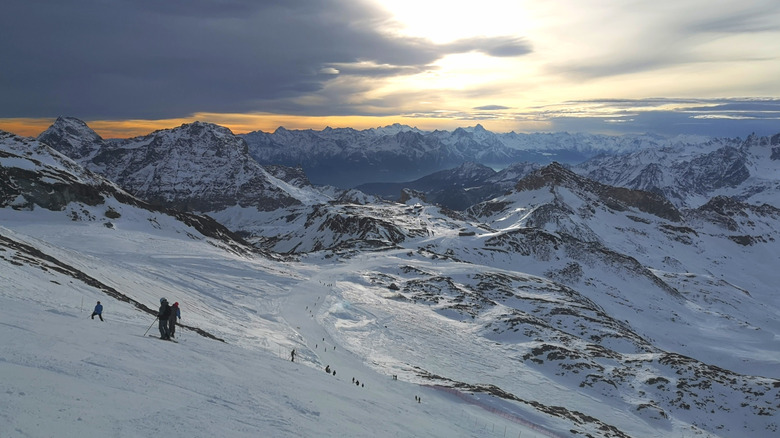 Ski slope and craggy mountain range