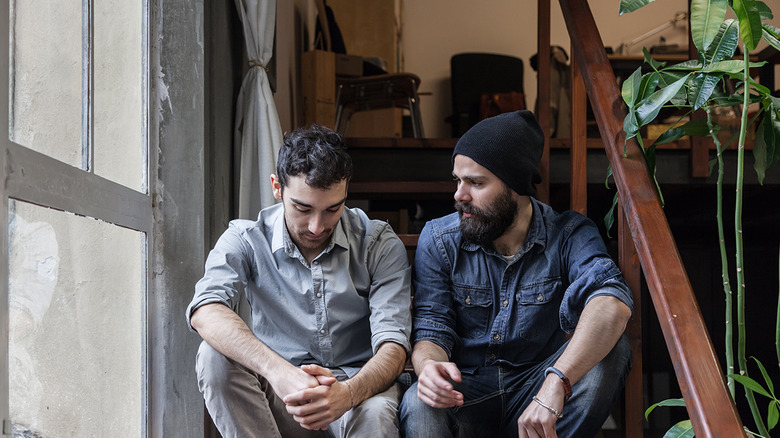 two male friends chatting