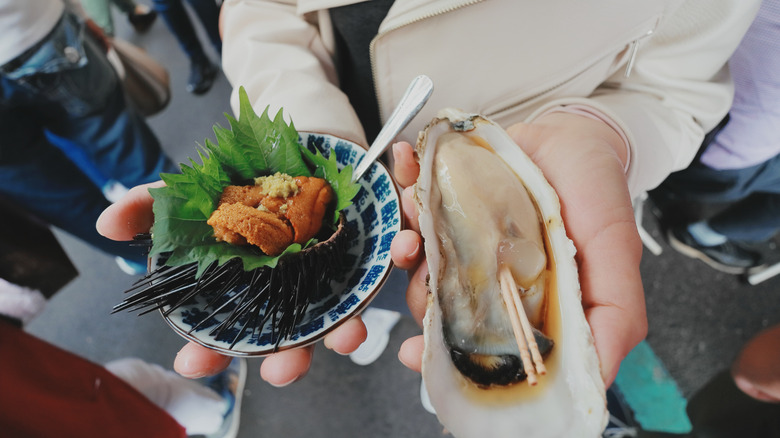 Fresh uni and a giant oyster at the Tsukiji Fish Market in Tokyo