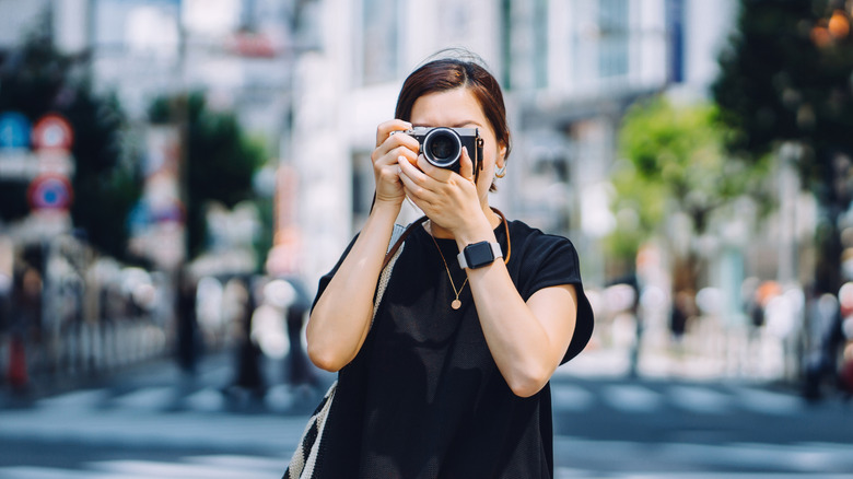 Woman taking a photo in Tokyo