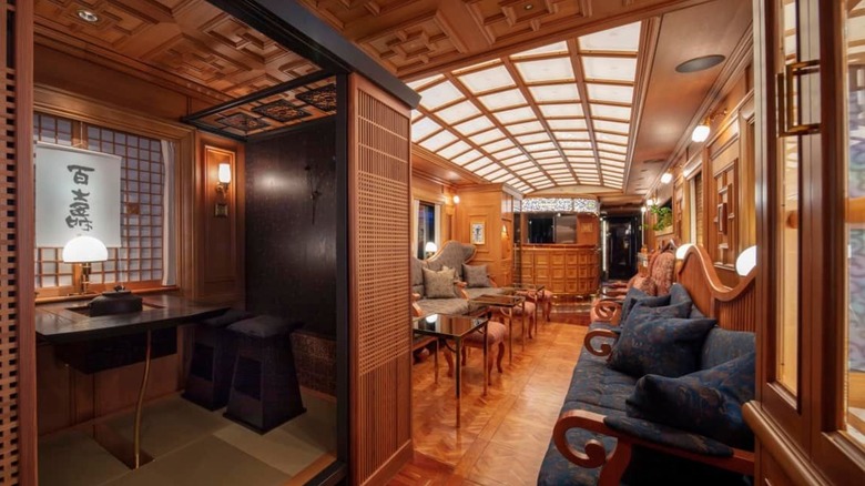 Inside opulent train car suite with wood details