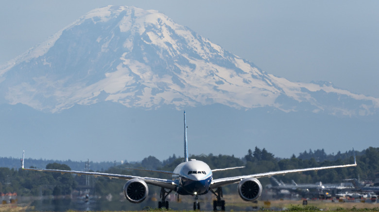 An airplane in front of Mount Rainier 