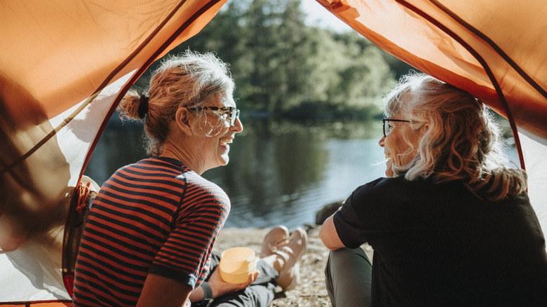 Two campers sharing a tent