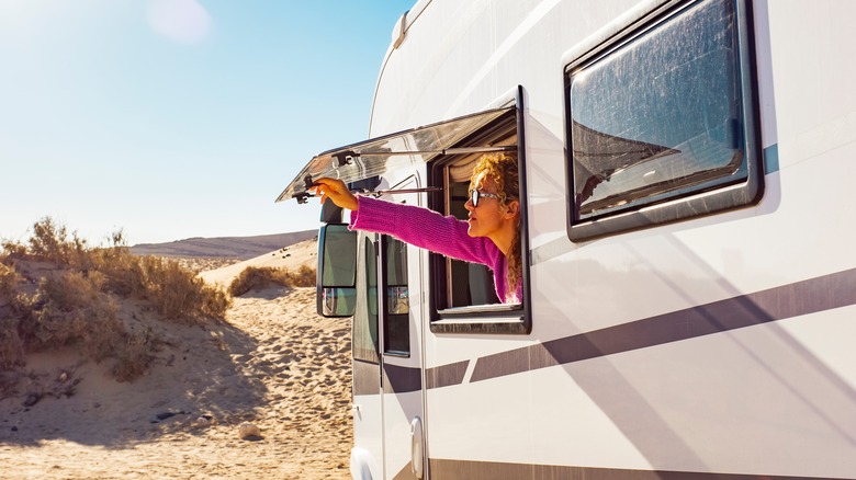 Woman opening RV window