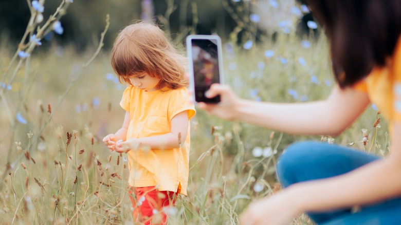 Taking a picture of a kid