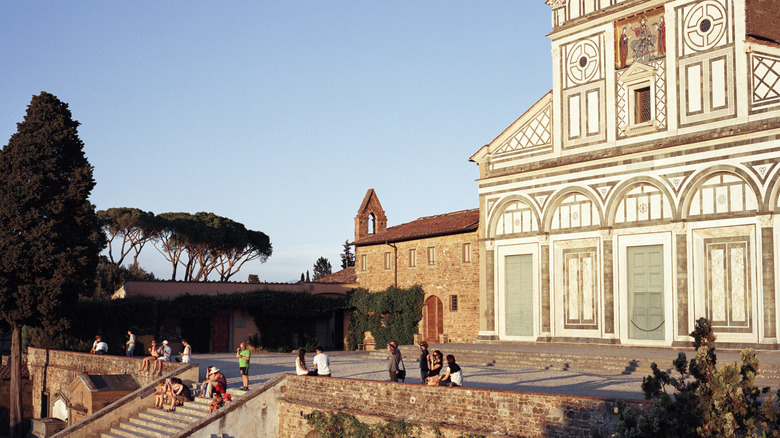 People gather at the foot of San Miniato Chuch in Florence