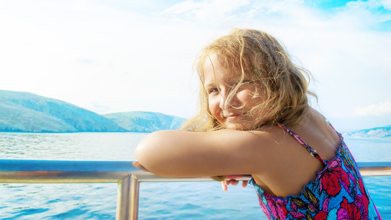 Young girl smiling on cruise ship