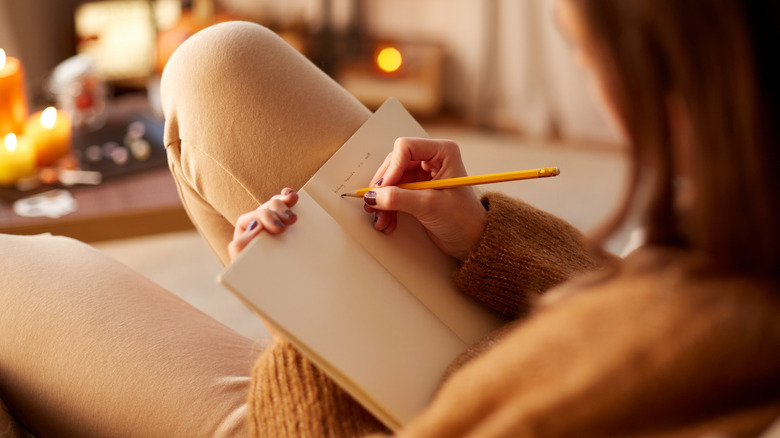 Girl writing in journal